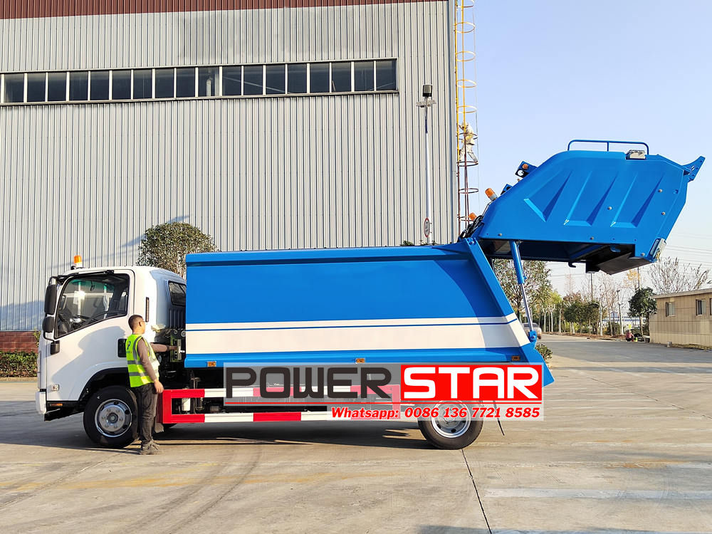 Isuzu ELF trash compactor truck