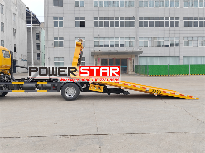 Isuzu flatbed wrecker truck