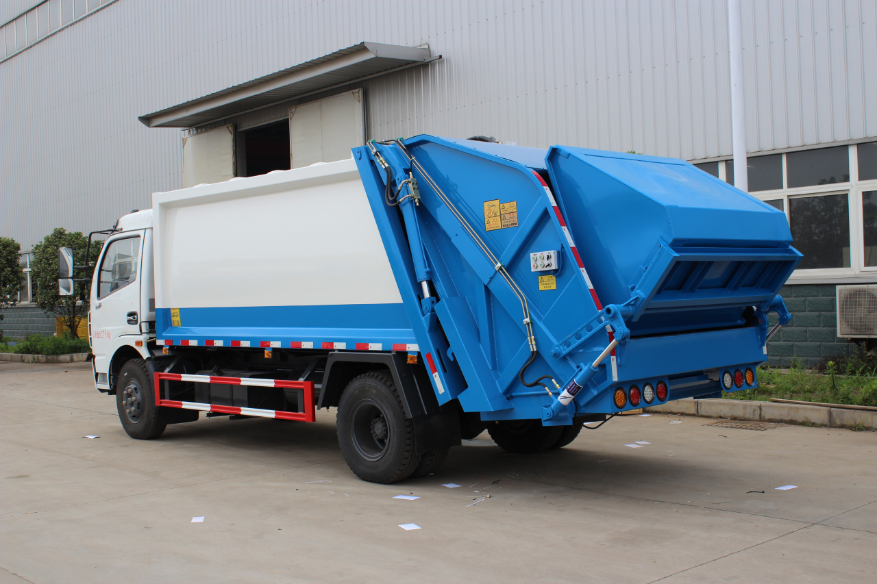 Isuzu trash compactor truck
