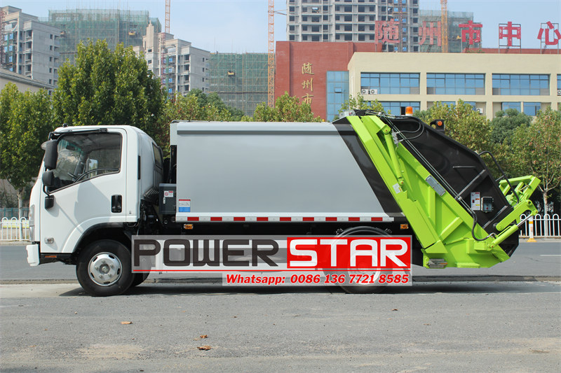 Side view of Isuzu garbage compactor truck