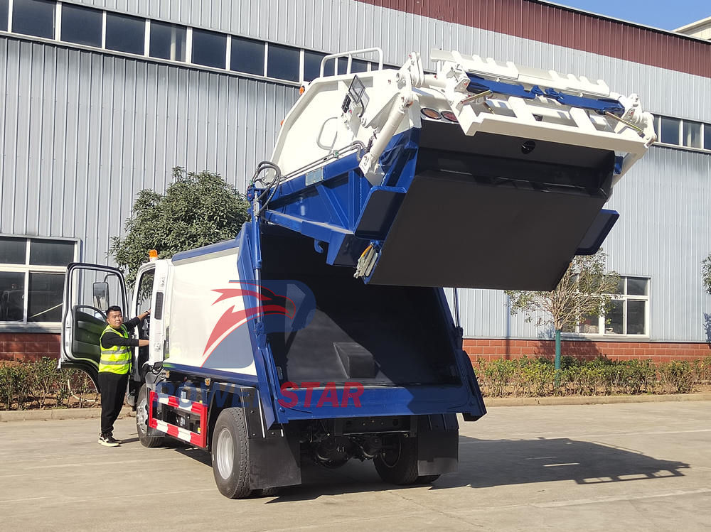 Isuzu EVM600 electric trash compactor truck