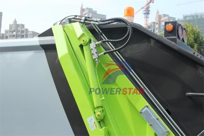 Isuzu truck with garbage compactor bodies