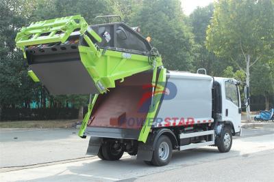 Isuzu truck with garbage compactor bodies