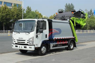 Isuzu truck with garbage compactor bodies
