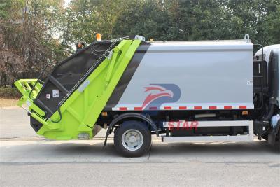 Isuzu truck with garbage compactor bodies