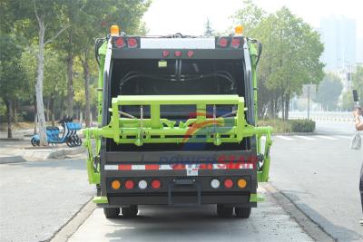 Isuzu truck with garbage compactor bodies