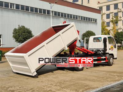 ISUZU NKR hook loader with garbage compactor