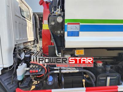 ISUZU NKR hook loader with garbage compactor