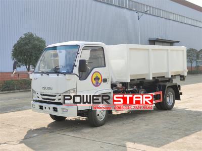 ISUZU NKR hook loader with garbage compactor