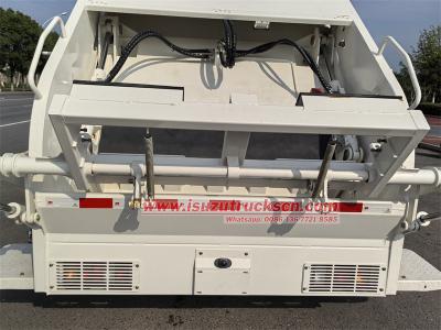 Isuzu NKR 100P garbage compactor truck