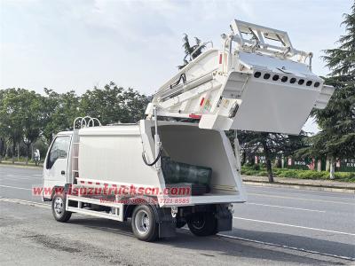 Isuzu NKR 100P garbage compactor truck